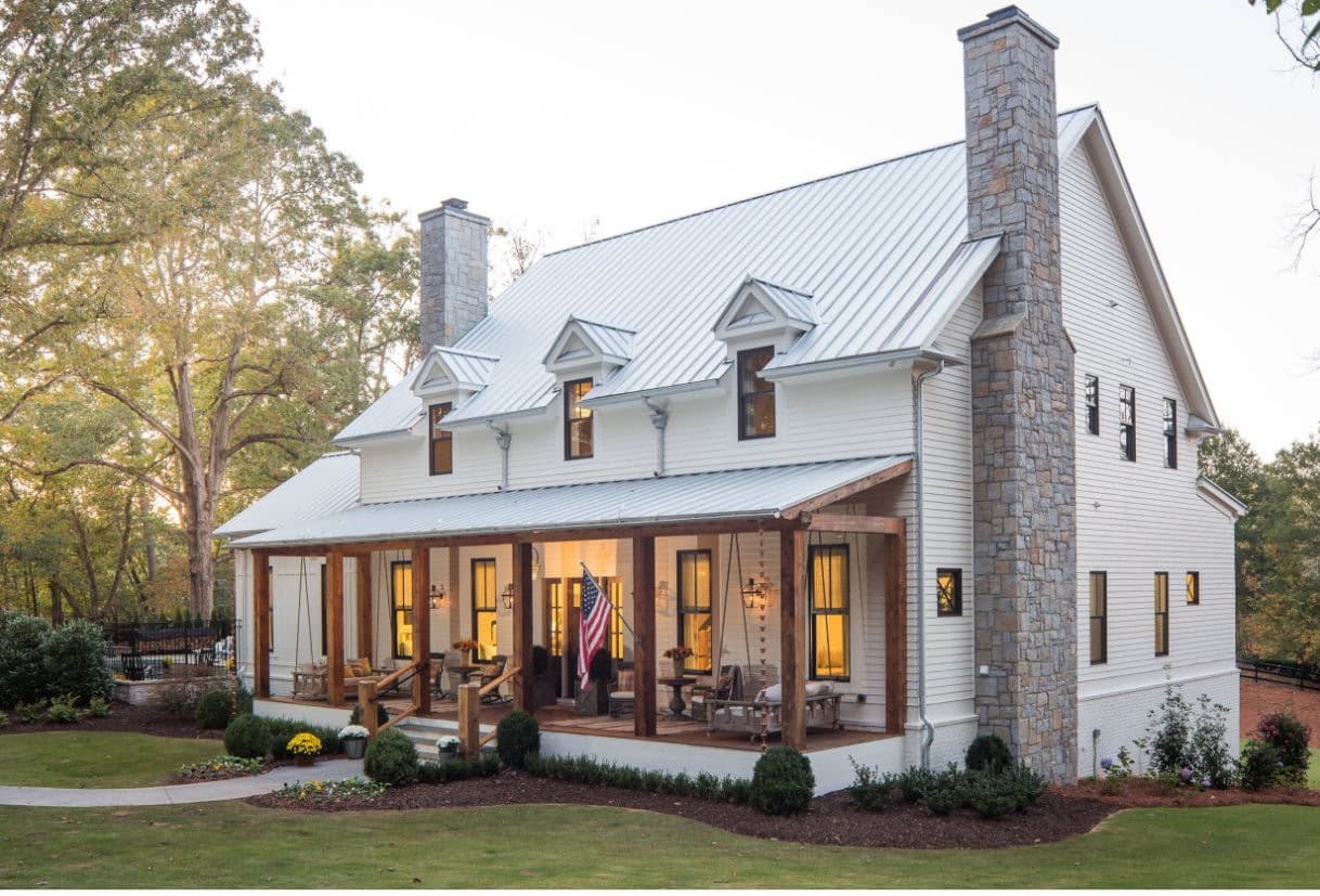 White farmhouse with new standing-seam metal roof